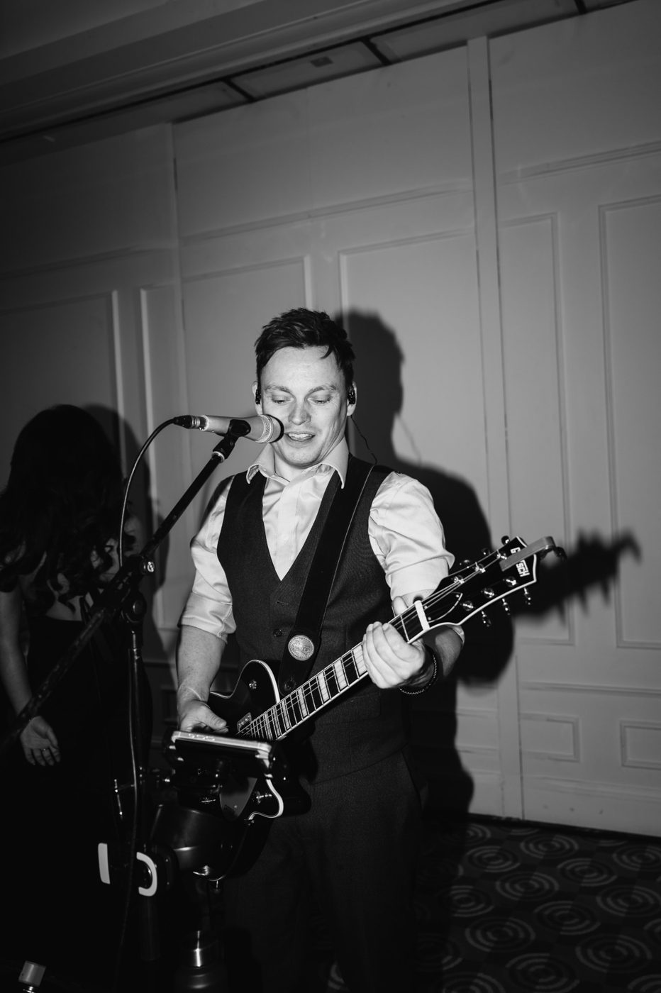 Mike singing and playing guitar